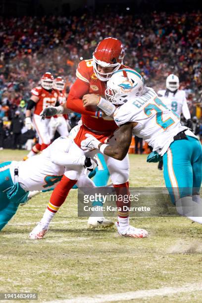The helmet worn by Patrick Mahomes of the Kansas City Chiefs cracks as he is tackled short of the goal line by DeShon Elliott and Kader Kohou of the...
