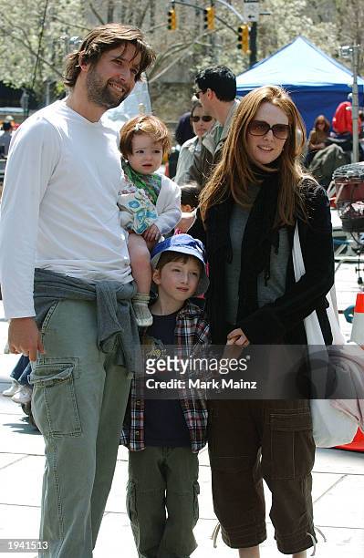 Actress Julianne Moore holds her son's hand while her partner, Bart Freundlich, carries their daughter, Liv Helen, while hanging out on the set of...