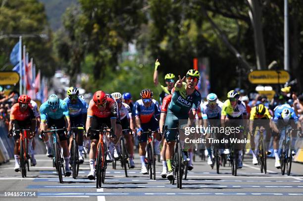 Sam Welsford of Australia and Team BORA - Hansgrohe celebrates at finish line as stage winner ahead of Elia Viviani of Italy and Team INEOS...