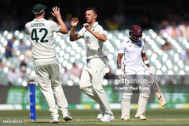 Josh Hazlewood of Australia celebrates the wicket of Kavem Hodge of the West Indies during day two of the First Test in the Mens Test match series...