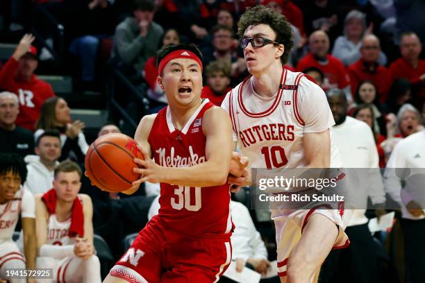 Keisei Tominaga of the Nebraska Cornhuskers in action against Gavin Griffiths of the Rutgers Scarlet Knights during a game at Jersey Mike's Arena on...