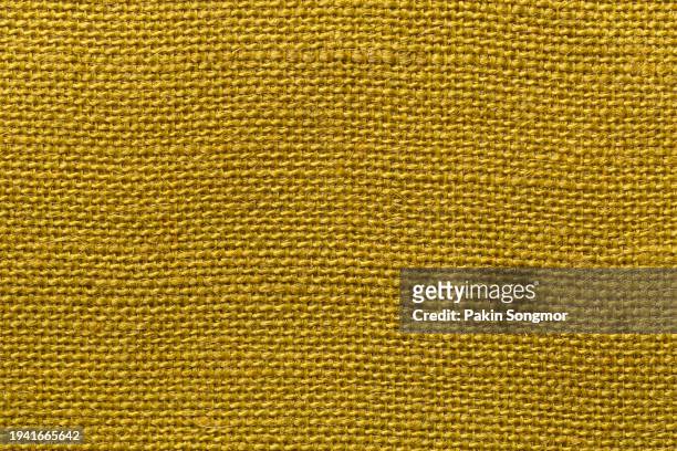 yellow sackcloth texture and textile background with full frame. - jute ストックフォトと画像