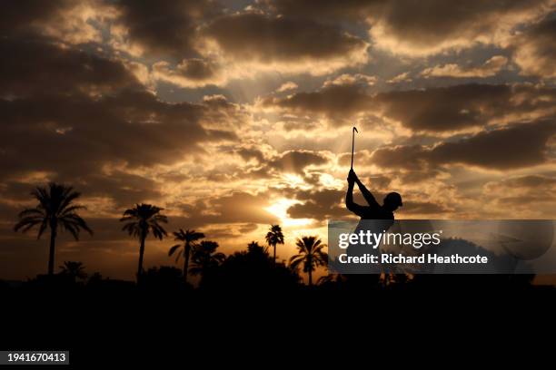 Tom McKibbin of Northern Ireland plays his second shot on the 10th on day one of the Hero Dubai Desert Classic at Emirates Golf Club on January 18,...