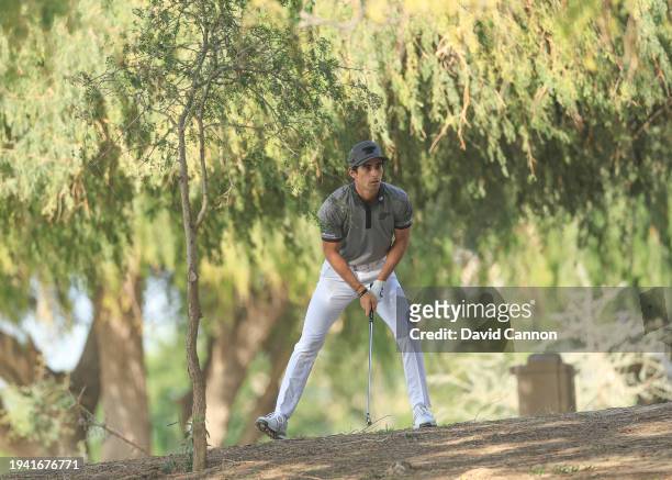 Joaquin Niemann of Chile plays his second shot on the 13th hole during the first round of the Hero Dubai Desert Classic on the Majlis Course at The...