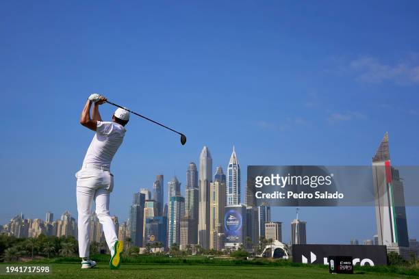 Haotong Li of China tees off on the 8th hole during the first round of the Hero Dubai Desert Classic on the Majlis Course at Emirates Golf Club on...