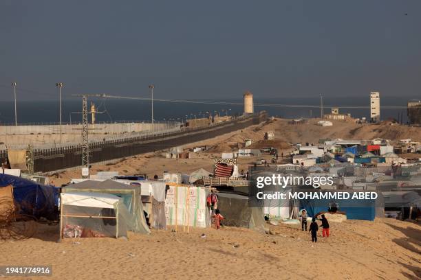 This photograph taken on January 21, 2024 shows a view of a makeshift tent camp housing displaced Palestinians in Rafah near the border with Egypt in...