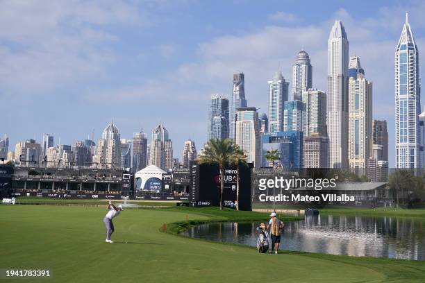 Rory McIlroy of Northern Ireland plays his second shot on the 18th hole on day one of the Hero Dubai Desert Classic at Emirates Golf Club on January...