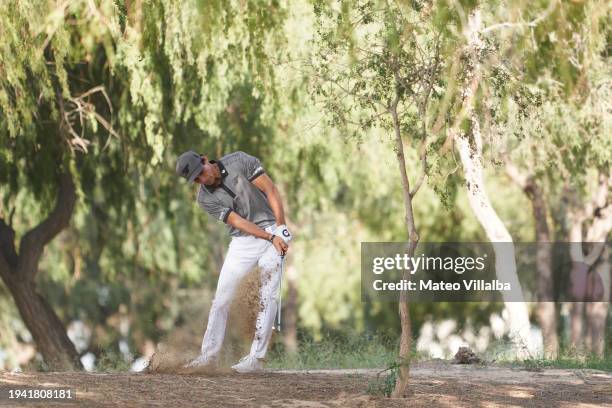 Joaquin Niemann of Chile plays his second shot on the 13th hole on day one of the Hero Dubai Desert Classic at Emirates Golf Club on January 18, 2024...