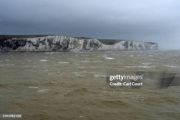 Cross channel ferry passes the White Cliffs as it approaches Dover docks on January 21, 2024 in Dover, England. The first boats of 2024 carrying...