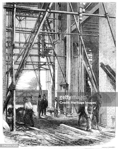 Progress of the Great Exhibition building: hoisting apparatus, 1861. The International Exhibition of 1862, or the Great London Exposition, was a...