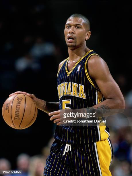 Jalen Rose, Small Forward, Shooting Guard and Point Guard for the Indiana Pacers in motion dribbling the basketball down court during the NBA Midwest...