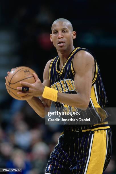 Reggie Miller, Shooting Guard for the Indiana Pacers holds the basketball during the NBA Midwest Division basketball game against the Milwaukee Bucks...