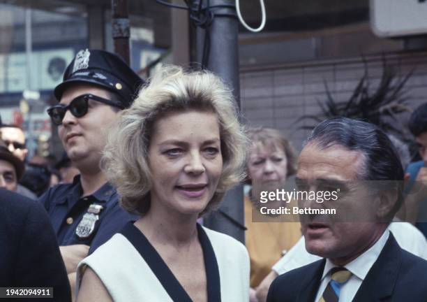 American actress Lauren Bacall and Jack Valenti , president of the Motion Picture Association of America, in Times Square, New York, July 25th 1967....