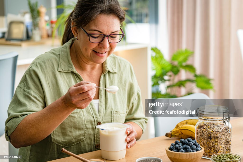 Woman eating greek yogurt
