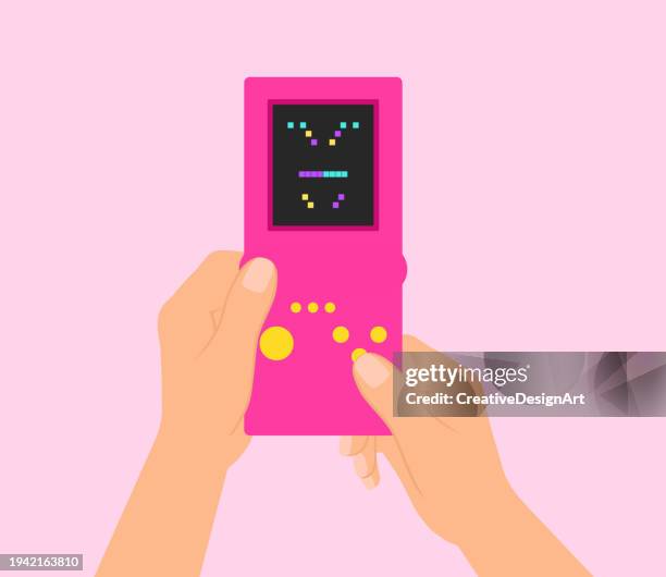 illustrazioni stock, clip art, cartoni animati e icone di tendenza di mano che tiene la console di gioco retrò e gioca a blocchi impilando videogioco - joypad