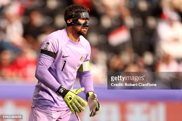 Mathew Ryan of Australia looks on whilst wearing a black armband in remembrance of Former Australia Player, Stephen Laybutt, during the AFC Asian Cup...