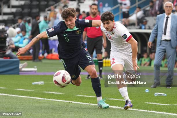 Ammar Ramadan of Syria and Jordan Bos of Australia compete for the ball during the AFC Asian Cup Group B match between Syria and Australia at Jassim...