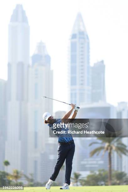 Tommy Fleetwood of England plays his second shot on the 13th hole during Round One of the Hero Dubai Desert Classic at Emirates Golf Club on January...
