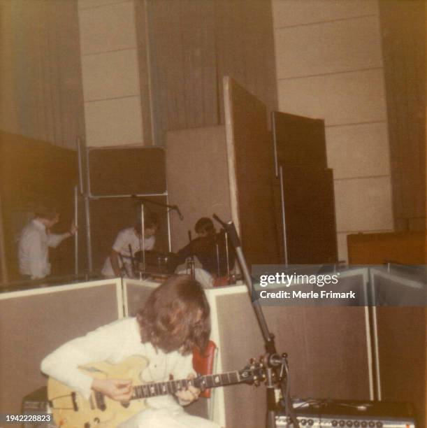 John Lennon playing guitar during The Beatles recording session for "Come Together" the Abbey Road Album at EMI Studios, July 23, 1969. Kevin...