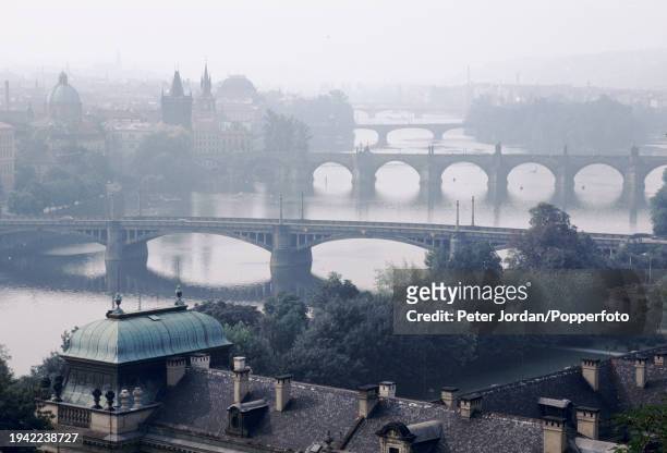Bridges, in foreground, Mánes Bridge and behind, the medieval stone arch Charles Bridge spanning the Vltava River in the city of Prague, capital of...