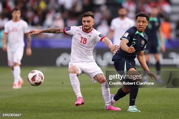 Jalil Elias of Syria battles for possession with Samuel Silvera of Australia during the AFC Asian Cup Group B match between Syria and Australia at...