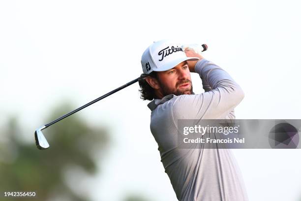 Cameron Young of the United States plays his second shot on the 18th hole during Round One of the Hero Dubai Desert Classic at Emirates Golf Club on...