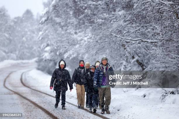 Members of the public walk along the A836 near Lairg as the met office issued weather alerts for snow as low temperatures continue across the north...