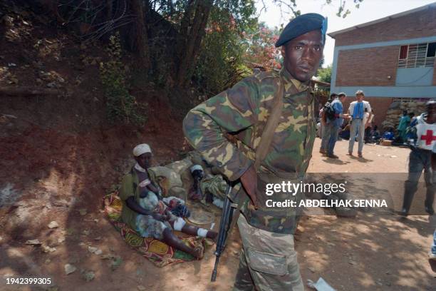 Governmental forces soldier stands on June 17, 1994 at the Red Cross hospital in Kigali, where about 180 wounded people were admitted following...