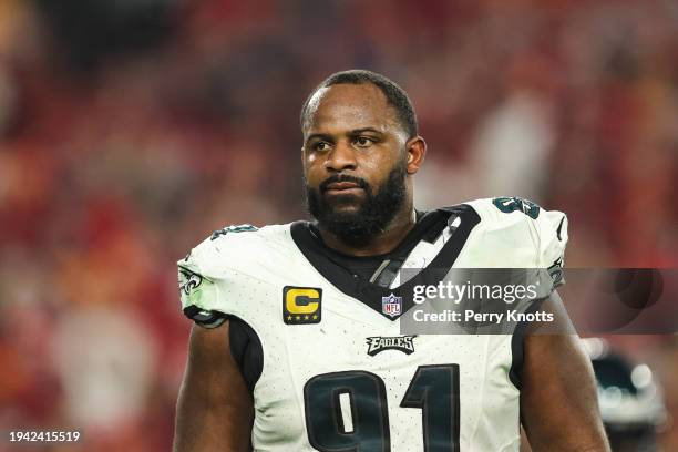 Fletcher Cox of the Philadelphia Eagles looks on from the field during an NFL Wild Card playoff football game against the Tampa Bay Buccaneers at...