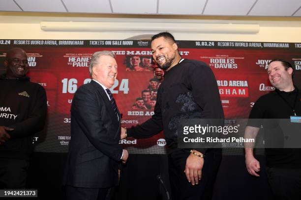 Joe Joyce interacts with promoter Frank Warren during the Magnificent Seven Ride Again Press Conference at Glaziers Hall on January 18, 2024 in...