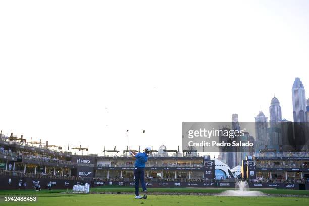 Tommy Fleetwood of England plays his third shot on the 18th hole during the first round of the Hero Dubai Desert Classic on the Majlis Course at...