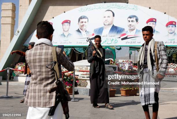 Yemen's Houthi movement's followers visit the tomb of Saleh al-Samad, the former Houthi-founded Supreme Political Council's president, on January 18,...