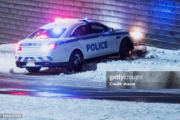 police on slippery road - police car driving stock pictures, royalty-free photos & images