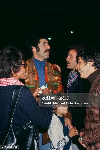 American actor Elliott Gould with his son Jason Gould, and American actor James Caan attend an event, US, circa 1975.
