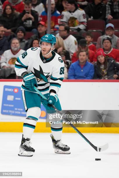 Mike Hoffman of the San Jose Sharks skates with the puck during the second period against the Chicago Blackhawks at the United Center on January 16,...