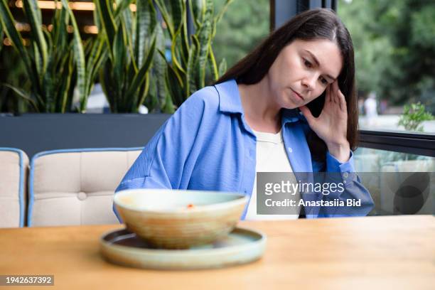 sad woman refusing from food in the restraunt. - picky eater stock pictures, royalty-free photos & images