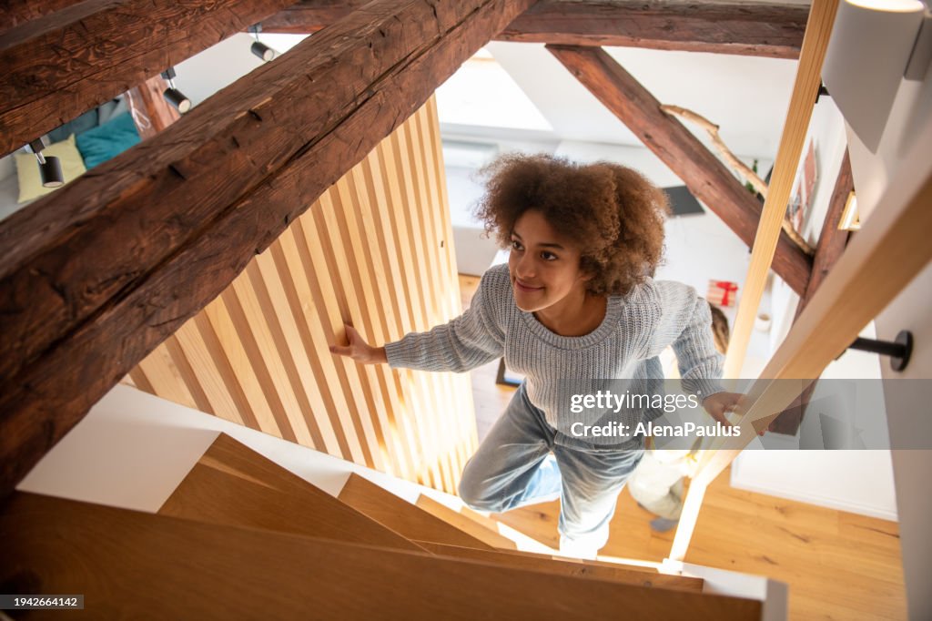 Young girl walking up the stairs