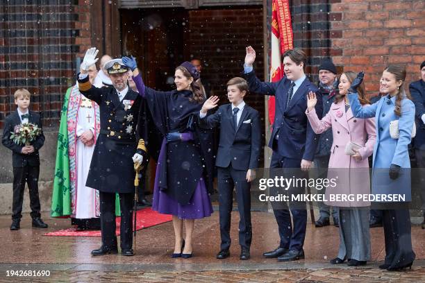 King Frederik X, Queen Mary, Prince Vincent, Crown Prince Christian, Princess Isabella and Princess Josephine greet the crowd after a church service...