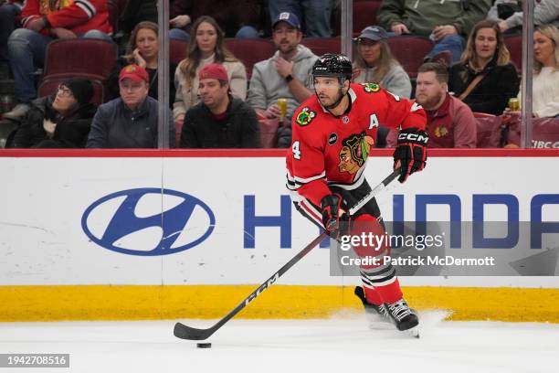 Seth Jones of the Chicago Blackhawks skates with the puck during the third period against the San Jose Sharks at the United Center on January 16,...