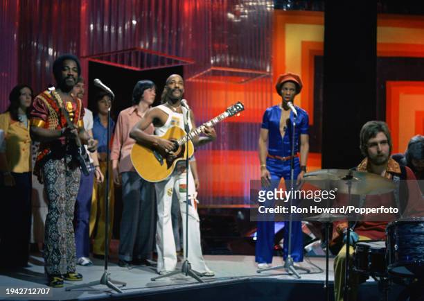 British soul group Hot Chocolate perform in front of a studio audience on the set of a pop music television show in London in November 1972. Members...