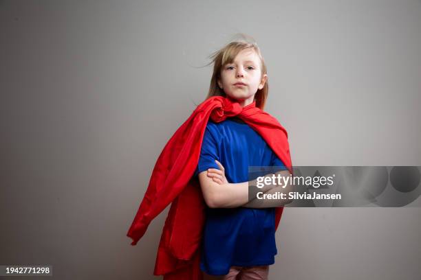 girl playing super hero - superhero girl stock pictures, royalty-free photos & images