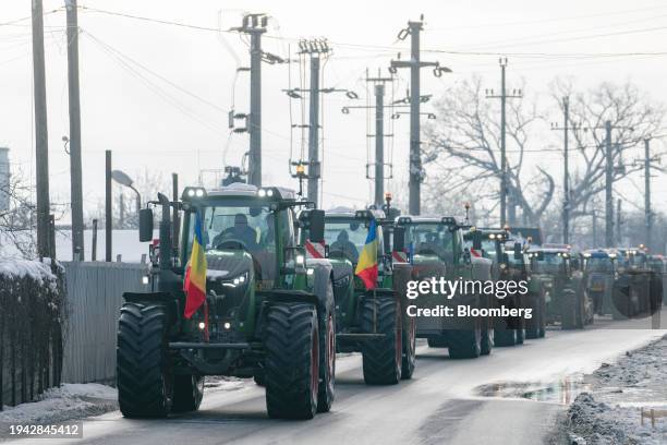 Convoy of tractors during an anti-government protest by farmers and truckers in Afumati, on the outskirts of Bucharest, Romania, on Sunday, Jan. 21,...