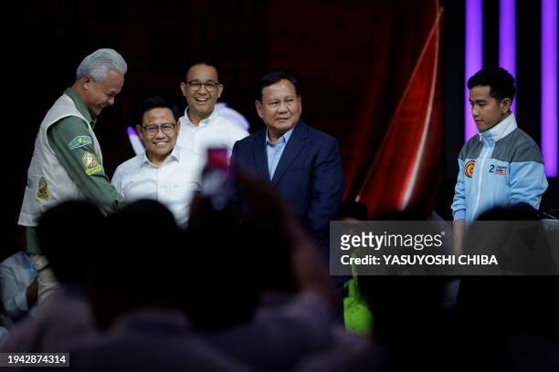 Presidential candidate and former Central Java governor Ganjar Pranowo , presidential candidate and Indonesia's Defence Minister Prabowo Subianto ,...