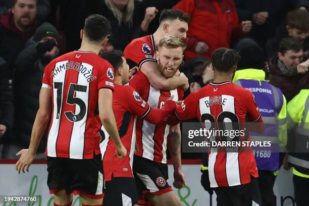 Sheffield United's English-born Scottish striker Oli McBurnie celebrates with teammates after scoring their second goal from the penalty spot during...