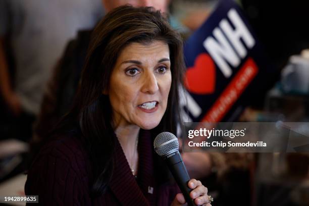 Republican presidential candidate and former UN Ambassador Nikki Haley talks to a group of people while campaigning at the historic Robie Country...