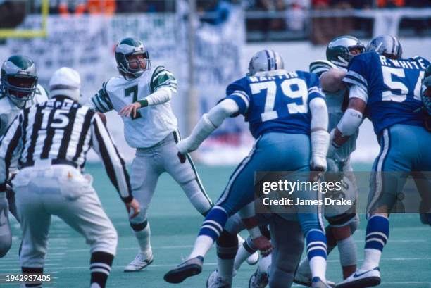 Philadelphia Eagles quarterback Ron Jaworski looks to pass as Dallas Cowboys defensive end Harvey Martin rushes in during the NFC Championship Game...