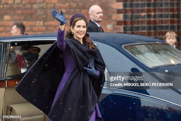 Queen Mary of Denmark greets the crowd as she arrives to a church service on the occasion of the change of throne in Denmark, in Aarhus Cathedral, on...