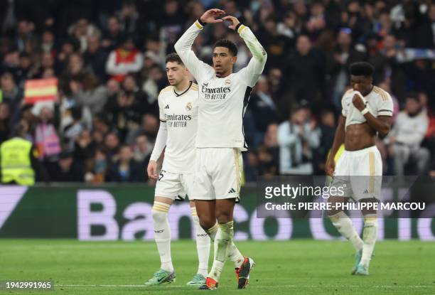 Real Madrid's English midfielder Jude Bellingham celebrates scoring his team's first goal during the Spanish League football match between Real...