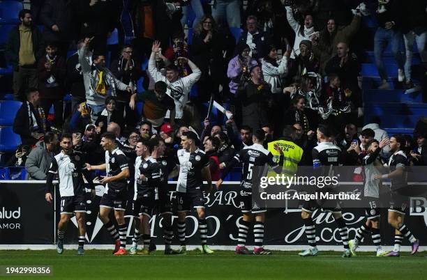 Alvaro Gomez of Unionistas CF celebrates scoring his team's first goal with teammates during the Copa del Rey Round of 16 match between Unionistas...