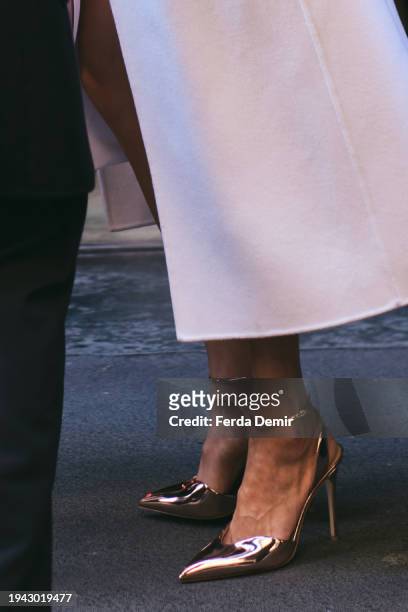 Guest wears a metallic heel sandals outside Giorgio Armani show during the Milan Fashion Week - Menswear Fall/Winter 2024-2025 on January 15, 2024 in...